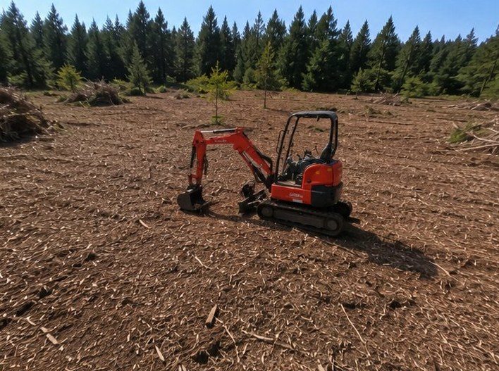 Same acreage mulched flat and usable with Kubota excavator on site